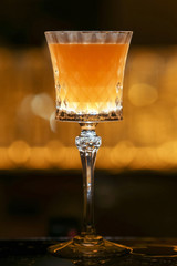 Bartender is making Pisco sour alcohol cocktail drink. Pisco sour cocktail drink with ice cubes