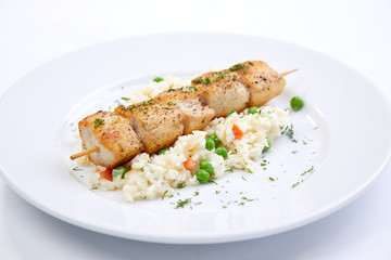 chicken kebab with rice and vegetables on the white background