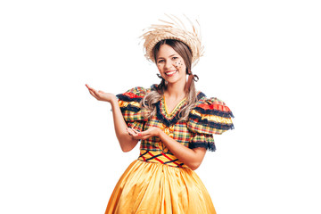 Brazilian woman wearing typical clothes for the Festa Junina showing something isolated on white background