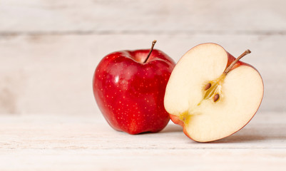 Apple cut on a wooden table