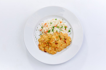 fried chicken breast with rice and vegetables on the white background