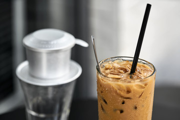 Macro photo of iced coffee drink on black table outdoors
