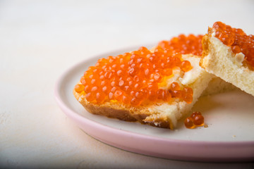 red caviar close up on bread
