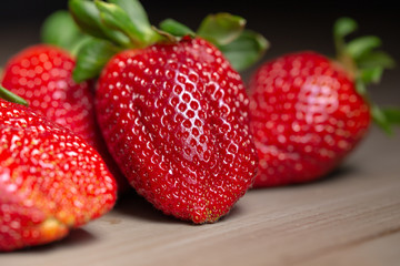 red ripe Strawberries on a wooden table