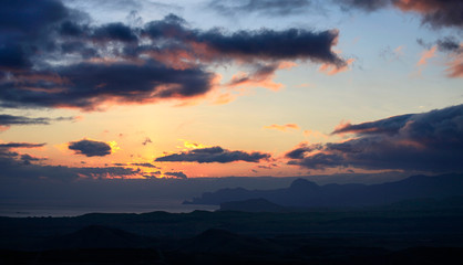 Fototapeta na wymiar Clouds in the evening sky at sunset on the coast of Crimea