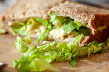 Making egg and onion sandwiches