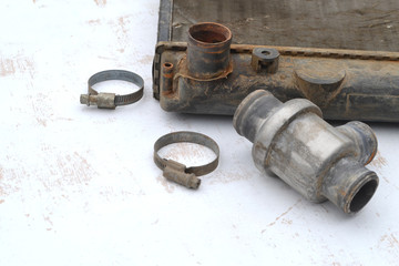 Used car radiator and thermostat. Close-up.