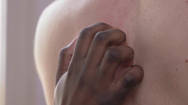 love, interracial sex concept.Black woman hand scratching back of white man