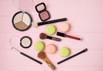 Makeup cosmetics, brushes and other essentials on white background. Top view, flat lay. Multicolored beauty tools and products collection, lipsticks, eyeshadow, mascara and more