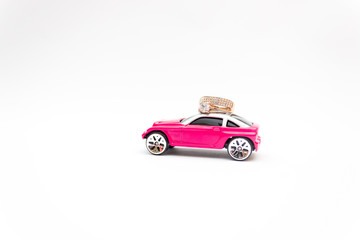 Fototapeta na wymiar toy car, gift box, delivery pink box
