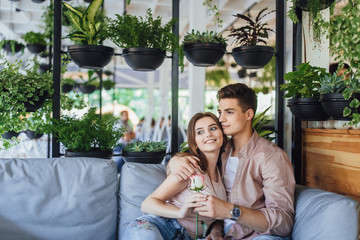 Beautiful couple on the summer terrace