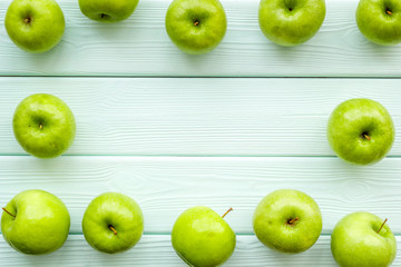 summer fruit pattern with apples on light wooden background top view copyspace