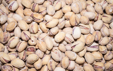 Roasted and salted pistachios in shell. Food background.