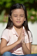 A Filipina Female Praying