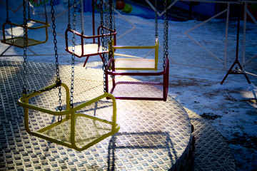 empty children's swing on the rides late at night