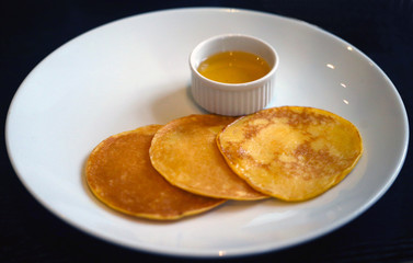 Big delicious pancake on a black background
