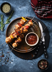 Chicken Shish kebab with mushrooms, cherry tomato and sweet pepper, Grilled meat skewers.