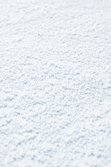 Fresh snow background texture. Winter background with snowflakes and snow mounds. Snow lumps.