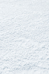 Fresh snow background texture. Winter background with snowflakes and snow mounds. Snow lumps.