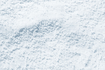 Fresh snow background texture. Winter background with snowflakes and snow mounds. Snow lumps.