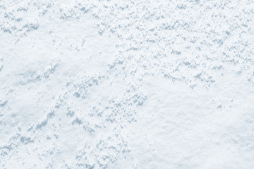 Fresh snow background texture. Winter background with snowflakes and snow mounds. Snow lumps.