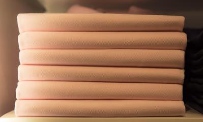 Stack of clothes on the store shelf