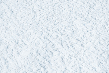 Fresh snow background texture. Winter background with snowflakes and snow mounds. Snow lumps.