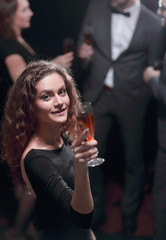 stylish young woman with glass of champagne
