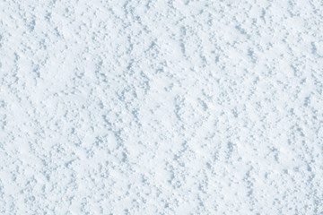 Fresh snow background texture. Winter background with snowflakes and snow mounds. Snow lumps.