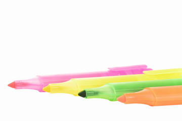 isolated yellow, orange, green and purple markers on the white background
