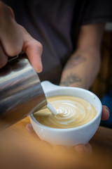 Fototapeta na wymiar making of latte arte in white cup