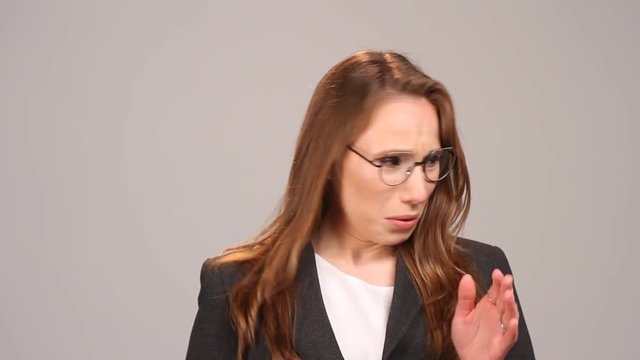 A young woman frowns at the bad smell in the room. Spoiled air. Bad smell