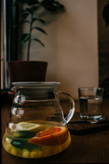 Ginger tea with mint and lemon and grapefruit. Herbal healthy drink in the teapot in local cafe