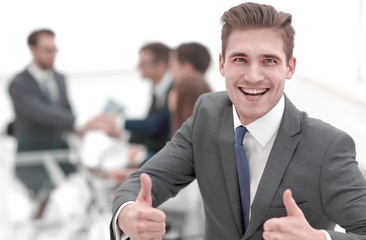 happy businessman showing thumbs up