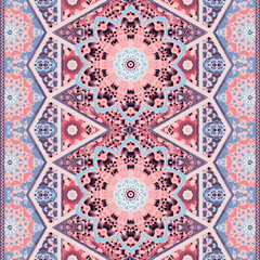 Seamless pattern in blue and pink tones in ethnic style. Zigzag, stylized flowers and mandala. Batik. Print for fabric.