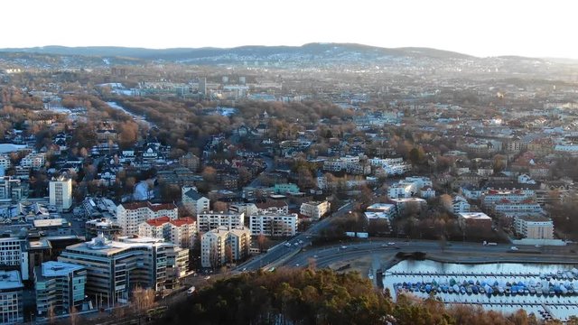 Aerial slow footage towards Skoyen and Frogner, e18 highway areas in Oslo, Norway at sunrise in spring 2019