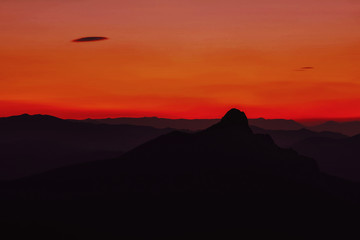 Dark red-blue sunset in the mountains