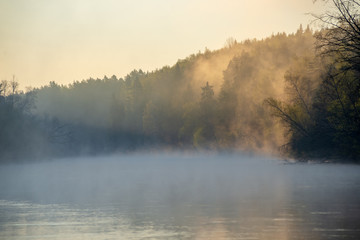 Fototapeta na wymiar beautiful misty morning on the natural forest river Gauja in Latvia