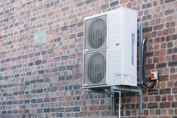 Condenser unit for air conditioning system wall mounted outdoors