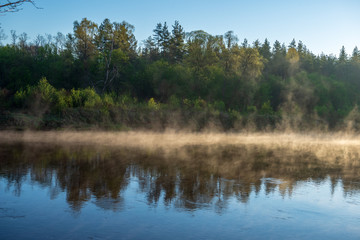 beautiful misty morning on the natural forest river Gauja in Latvia
