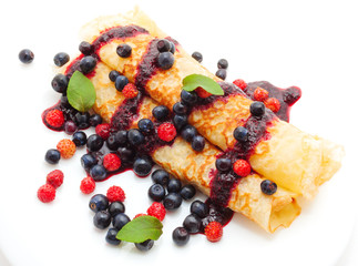 fresh pancakes with berry sauce with blueberries
