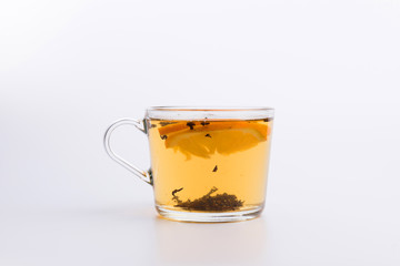 Glass cup of black tea with lemon. Isolated on white background