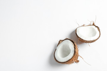 Fototapeta na wymiar Split tropical coconut isolated on white background