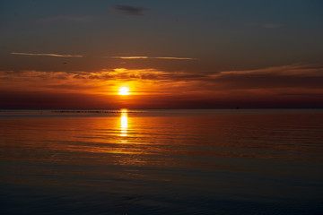 Fototapeta na wymiar calm sunset with no wind on the lake