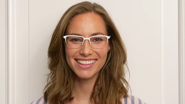 Woman wearing white glasses