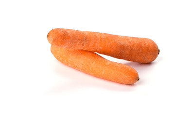 Two washed carrots isolated on white background. Copy space