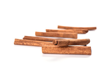 Soft focus. A few cinnamon sticks isolated on white background. Spice concept