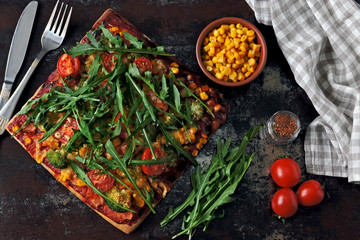 Vegan pizza with vegetables and sauce. Healthy fast food. Keto pizza. Square pizza.
