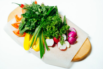 Fresh vegetables on a wooden board.