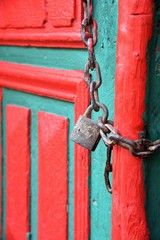 a red door with big lock